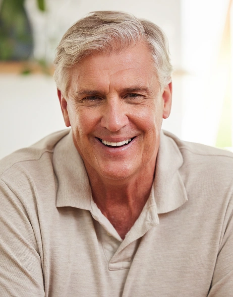 smiling patient at dentist fitchburg dental implants
